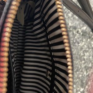 Kate Spade pink and black cross body . Soft leather small in size.